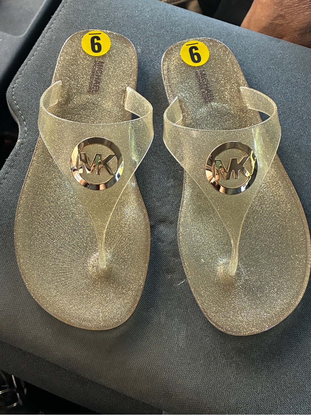 Michael Kors Clear Pale Gold Glitter Jelly Thong Sandals with Gold MK Medallion